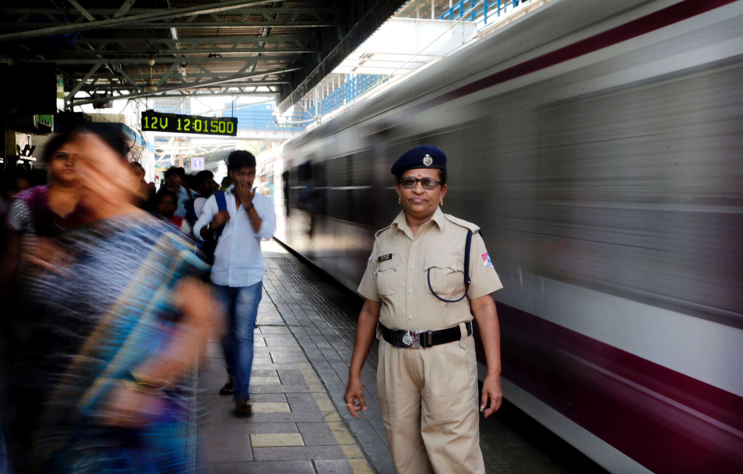 PHOTO: A railway police officer stands at Matunga Road train station on Western Railway line in Mumbai, India, Thursday, March. 8, 2018.