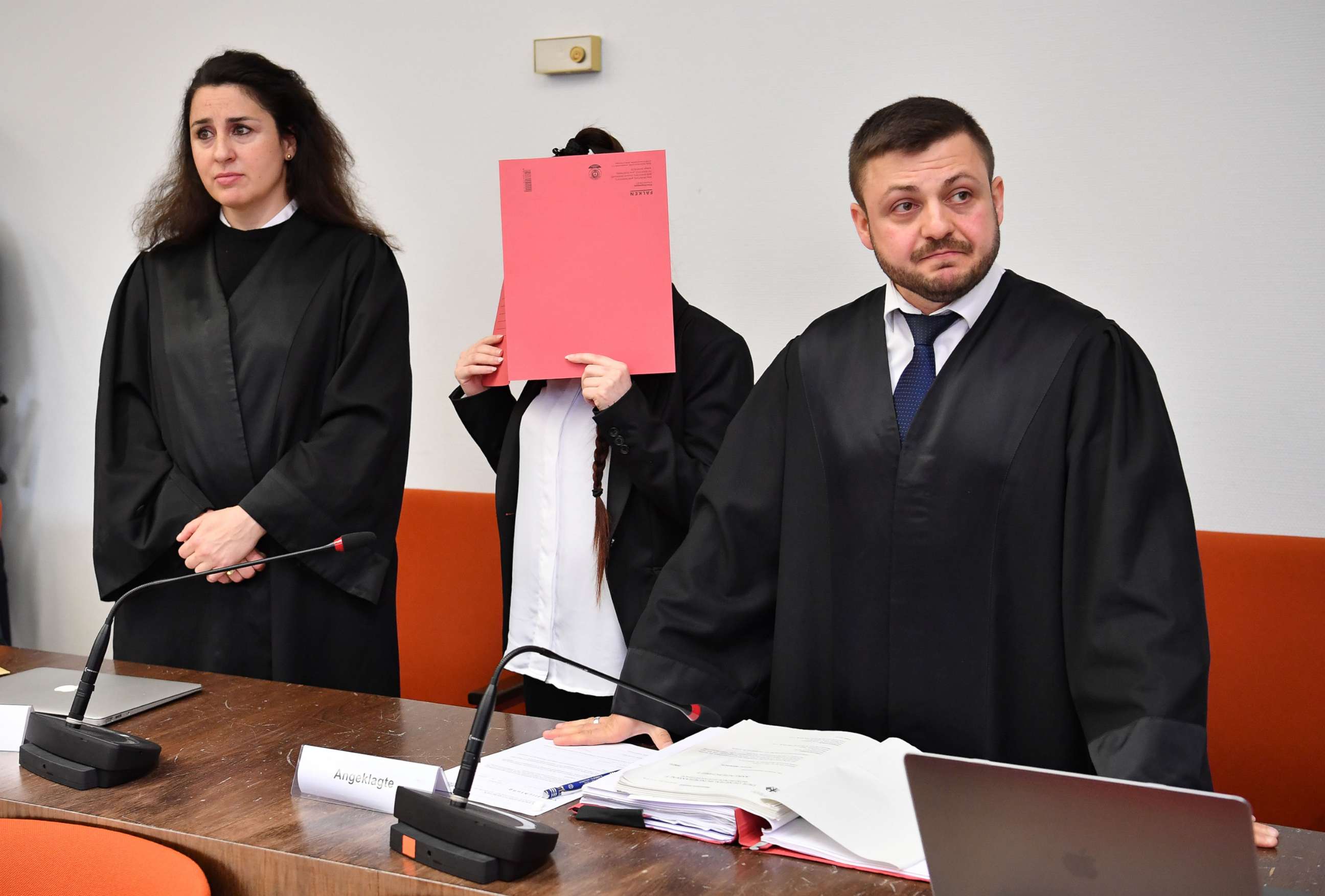 PHOTO:Jennifer W. stands in between her lawyers Ali Aydin and Seda Basay-Yildiz at the first day of her trial at the Oberlandesgericht courthouse, April 9, 2019, in Munich.