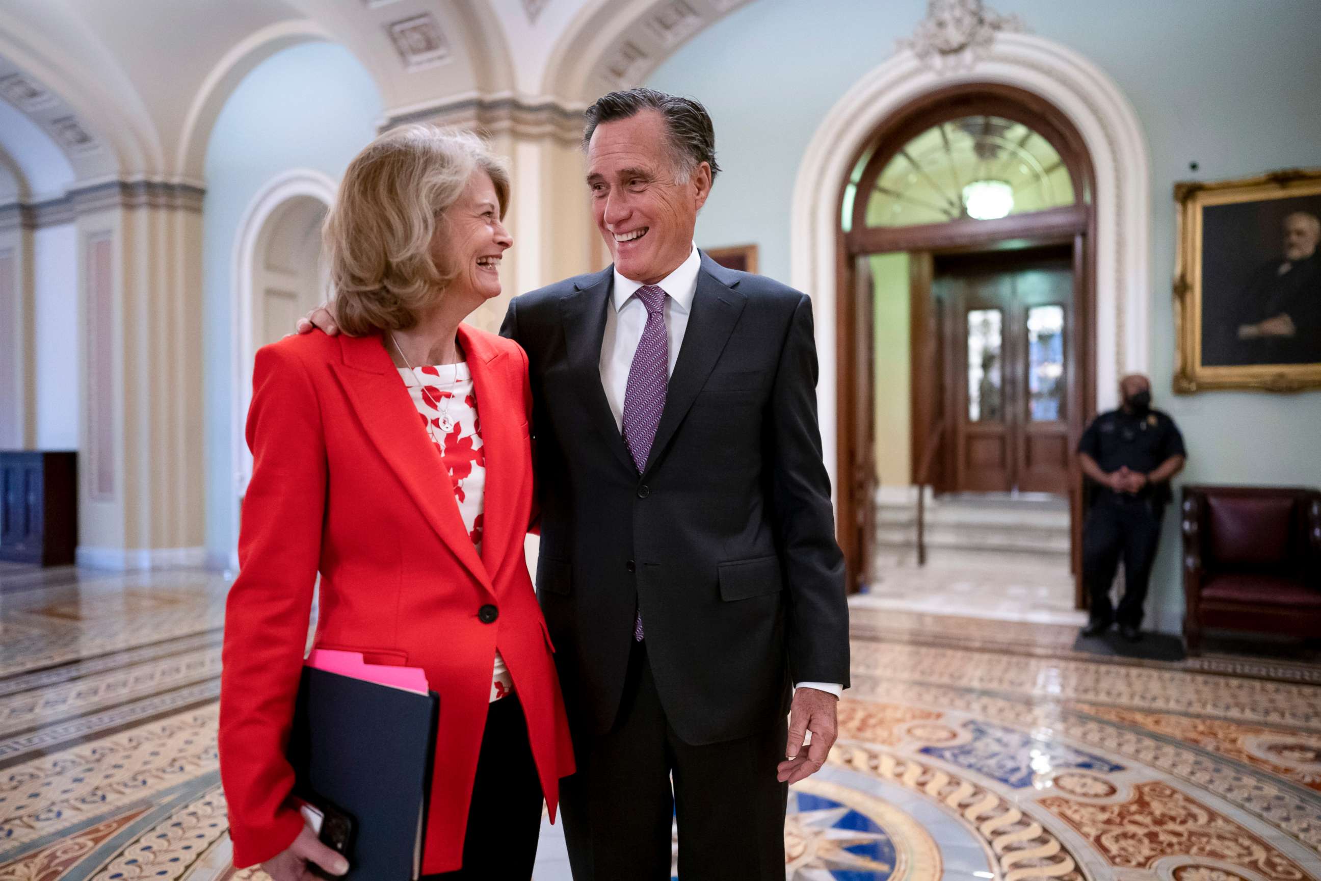 PHOTO: Republican Senators Lisa Murkowski, left, and Mitt Romney, who say they will vote to confirm Judge Ketanji Brown Jackson's historic nomination to the Supreme Court, smile as they greet each other at the Capitol in Washington, April 5, 2022.