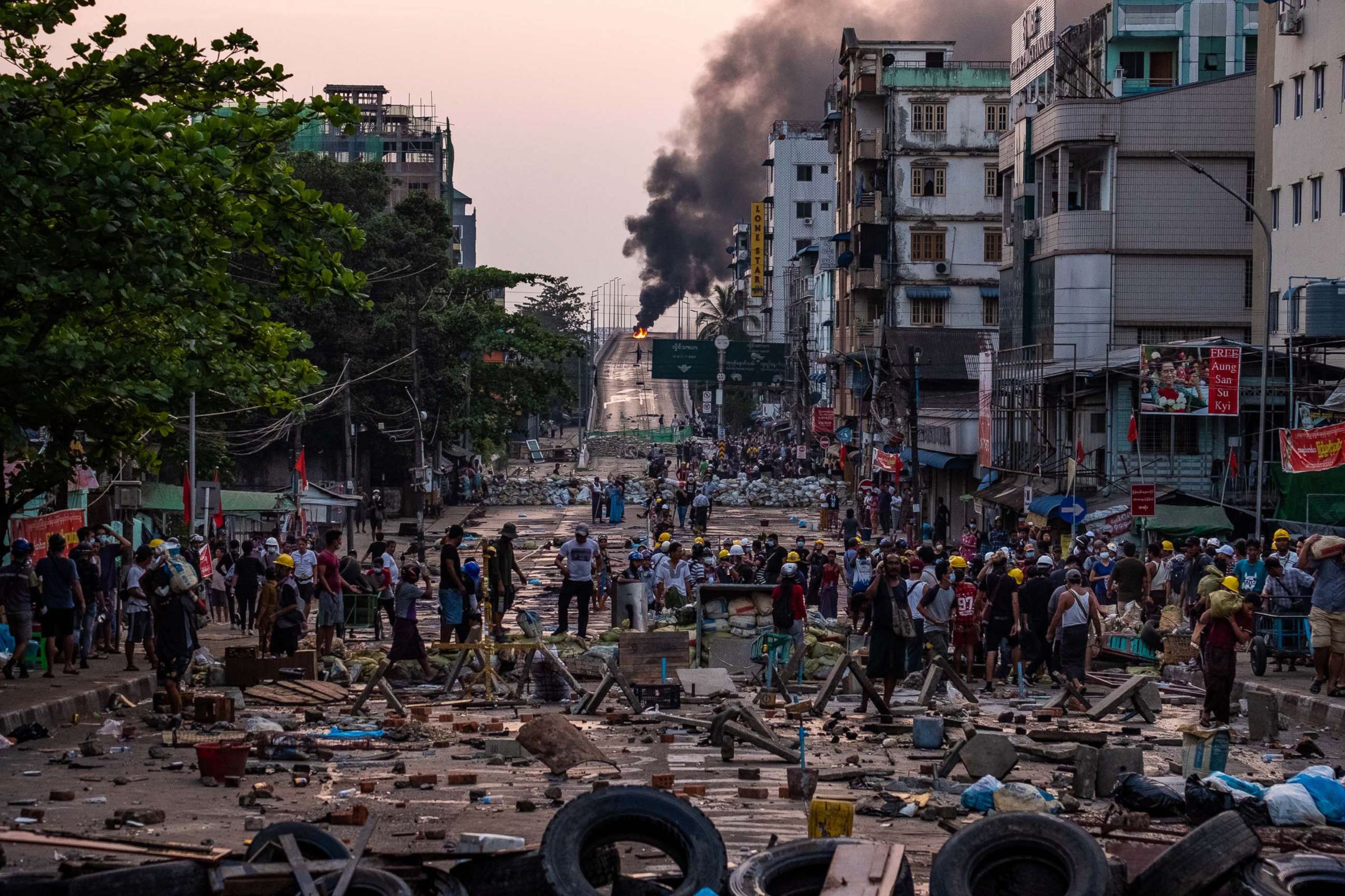 PHOTO: Smoke rises from tires burning at barricades erected by protesters after military junta forces attempted to breach them, March 16, 2021, in Yangon, Myanmar. 