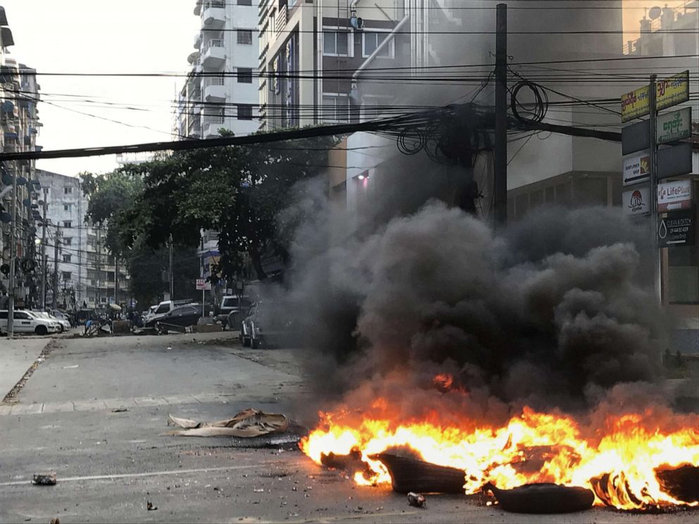 PHOTO: Black smoke rises from tires on a road in Yangon, Myanmar, on March 27, 2021.