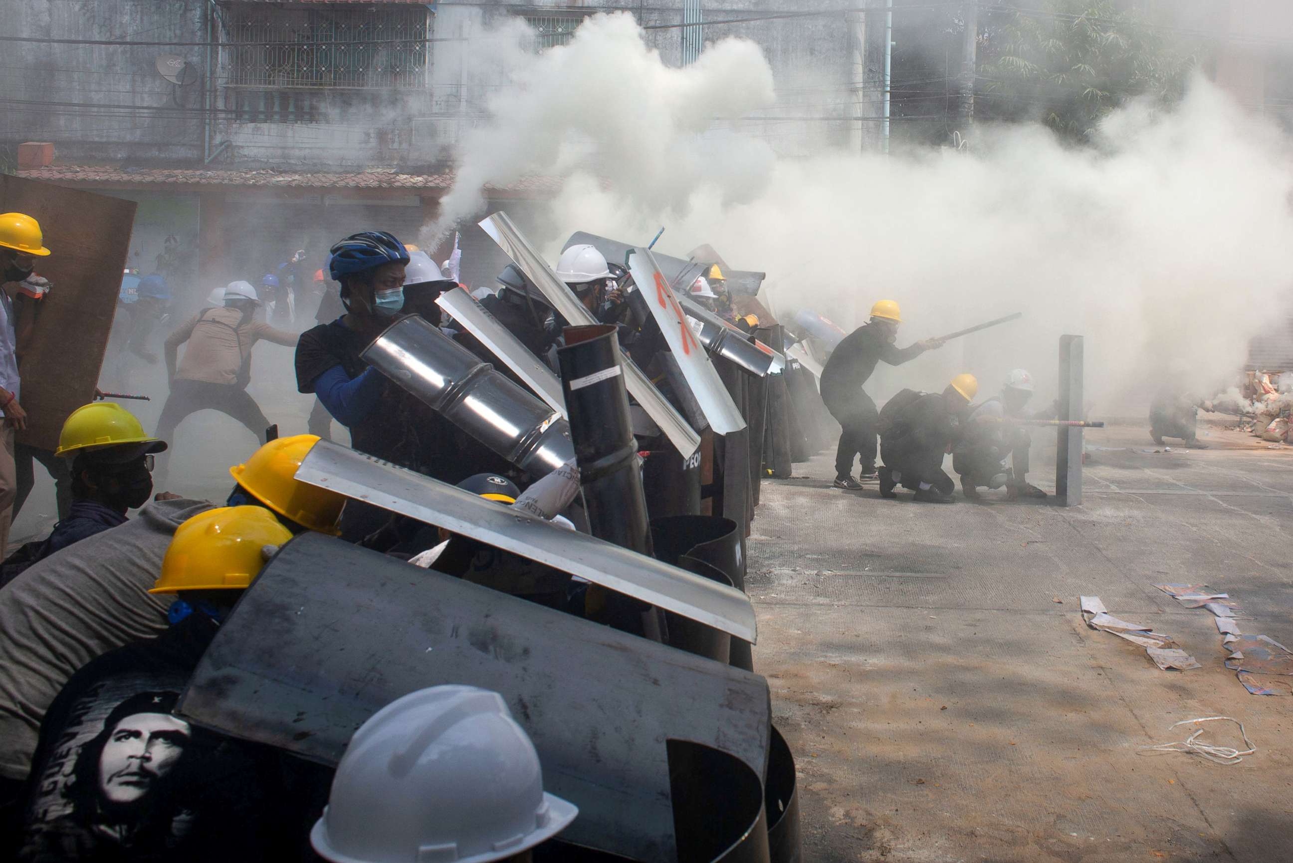 PHOTO: Protesters cover with makeshift shields during a protest in Yangon, Myanmar, March 3, 2021.