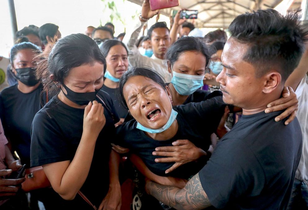 PHOTO: Thida Hnin cries during the funeral of her husband Thet Naing Win at Kyarnikan cemetery in Mandalay, Myanmar, Feb. 23, 2021. Thet Naing Win was shot and killed by Myanmar security forces during an anti-coup protest on Feb. 20.