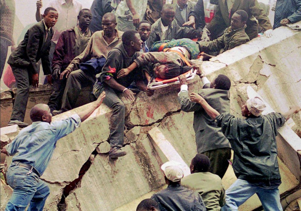 PHOTO: Rescue workers carry Susan Francisca Murianki, a U.S. Embassy office worker, over the rubble of a collapsed building next to the embassy, Aug. 7, 1998 in Nairobi, Kenya. 