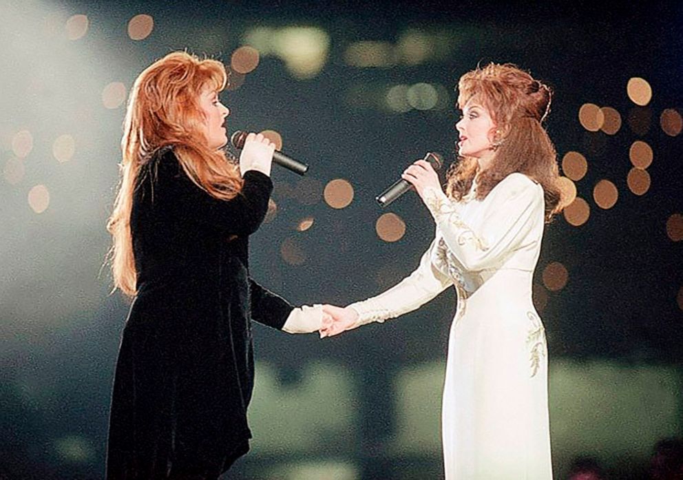 PHOTO: Wynonna Judd, left, and her mother, Naomi Judd, of The Judds, perform during the halftime show at Super Bowl XXVIII in Atlanta, Jan. 30, 1994.