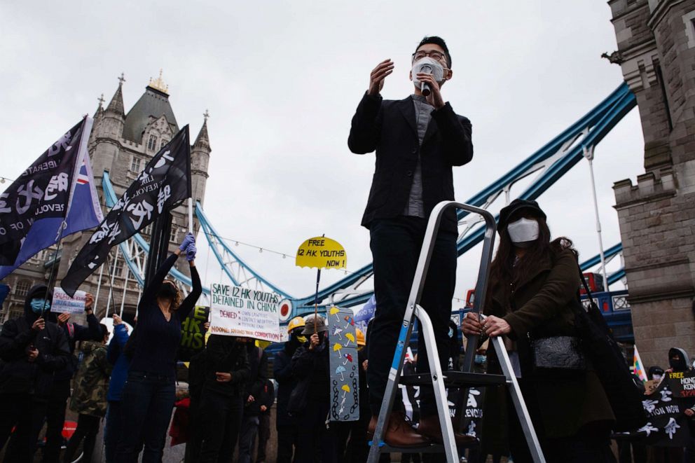 PHOTO: Exiled Hong Kong pro-democracy activist Nathan Law addresses a rally at Potters Fields Park beside Tower Bridge in London, Oct. 24, 2020.