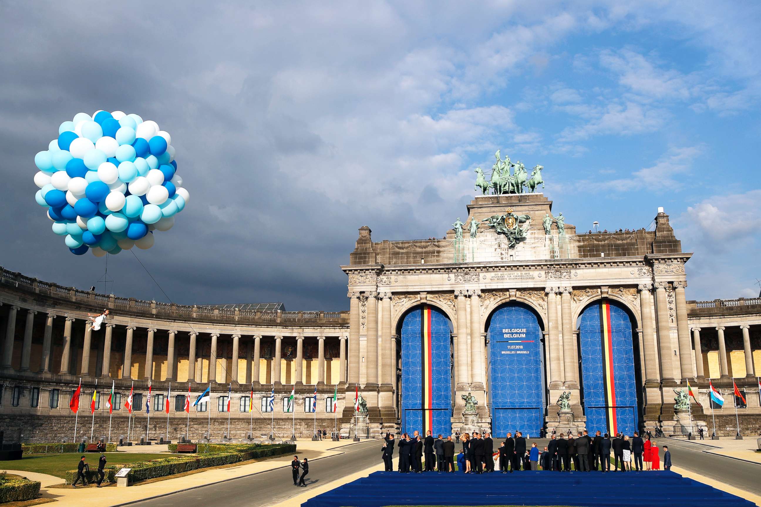 PHOTO: A dancer performs under balloons during a group photo of NATO heads of state and government at Park Cinquantenaire in Brussels, July 11, 2018.