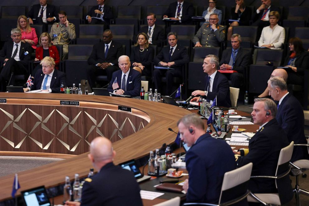 PHOTO: British Prime Minister Boris Johnson, seated left, and President Joe Biden, listen as NATO Secretary General Jens Stoltenberg speaks during a NATO summit to discuss Russia's invasion of Ukraine, on March 24, 2022 in Brussels. 