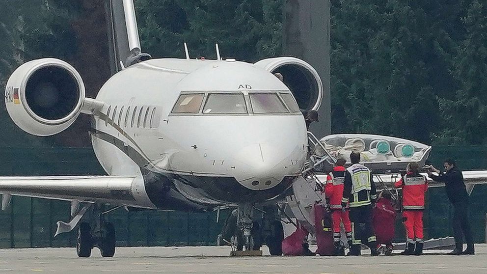 PHOTO: A stretcher is taken from an aircraft carrying Kremlin critic Alexei Navalny at Tegel Airport in Berlin, Aug. 22, 2020.