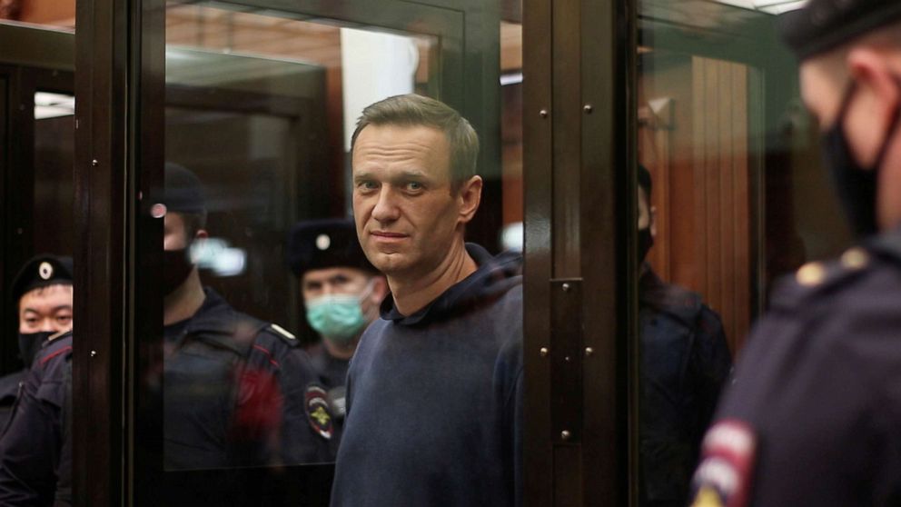 PHOTO: A still image taken from video footage shows Russian opposition leader Alexei Navalny inside a defendant dock during the announcement of a court verdict in Moscow, Feb. 2, 2021.