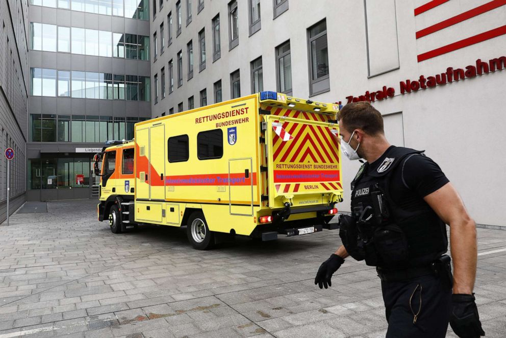 PHOTO: Policemen guard the medical vehicle of the German Army which carried the Russian opposition politician Alexei Navalny, in front of the Charite Hospital on Aug. 22, 2020, in Berlin, Germany.