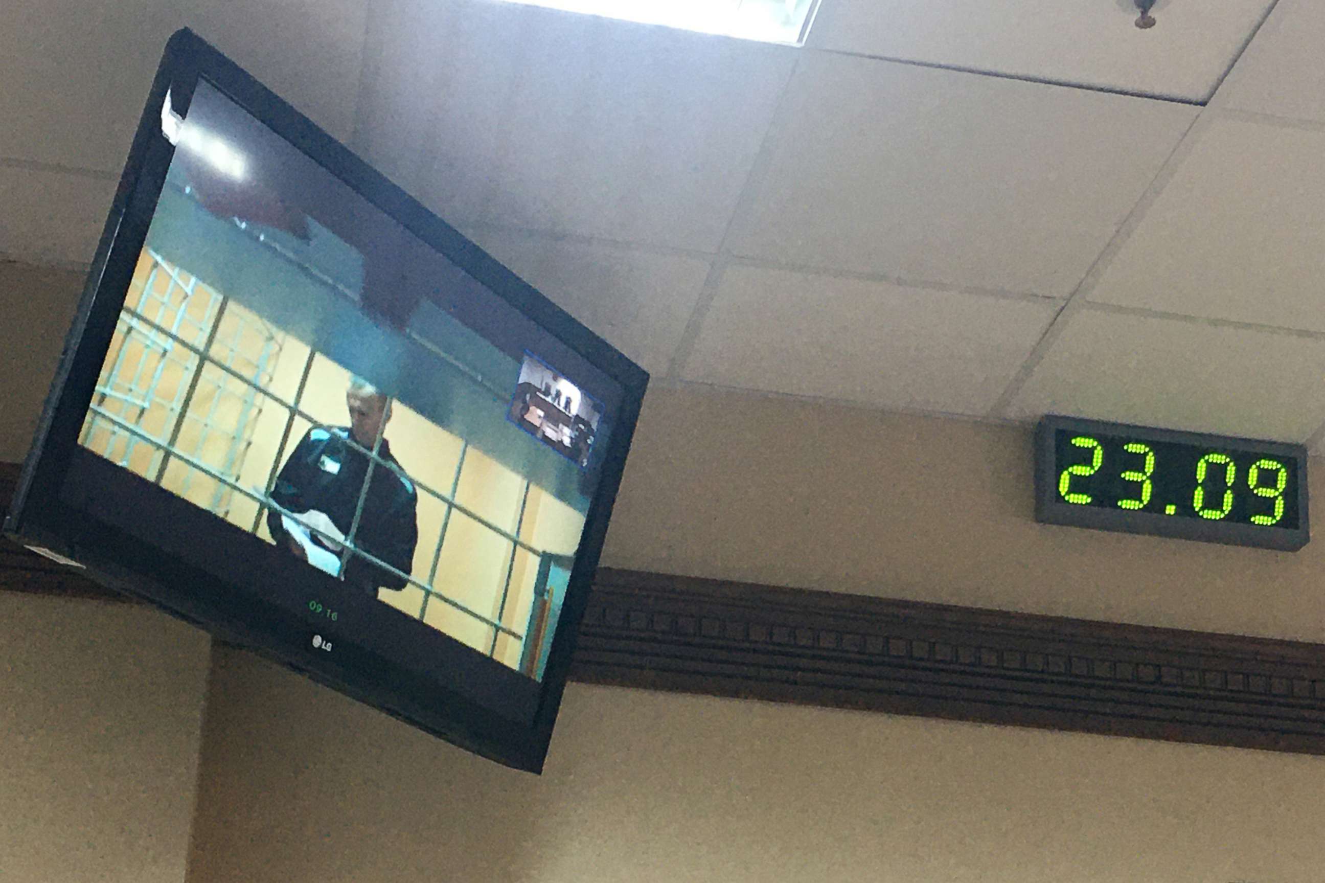 PHOTO: Jailed opposition activist Alexei Navalny is pictured on a video screen in the Vladimir Region Court as he joins a hearing into his appeal against a ruling by the Petushki District Court, on Sept. 23, 2021.