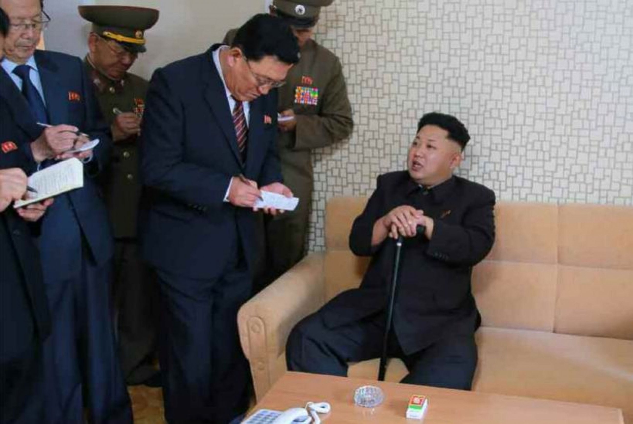 PHOTO: A photo released by North Korea's official news agency on Oct 14, 2014 shows North Korean leader Kim Jong-un using a cane during his first public appearance in weeks.