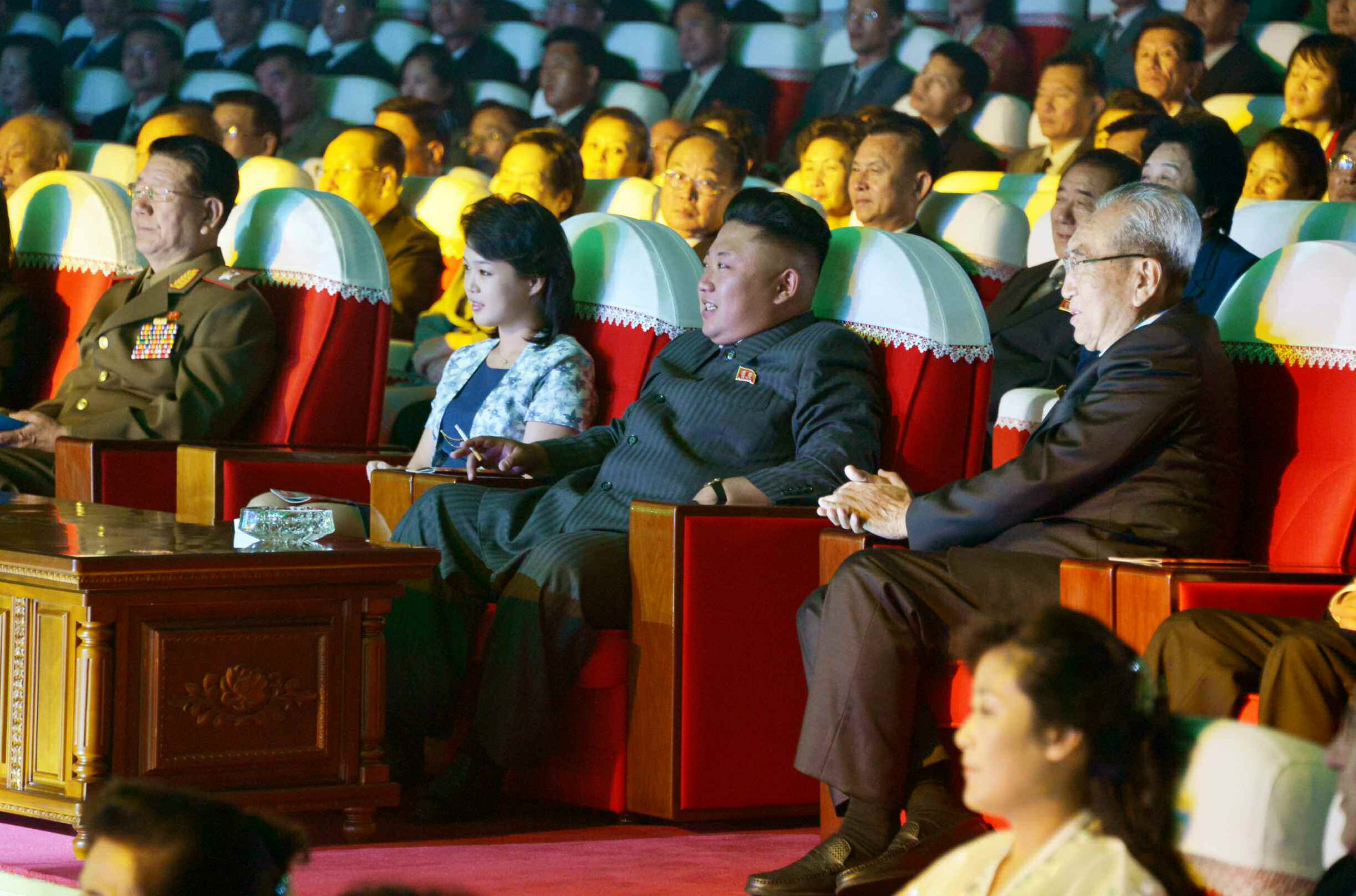PHOTO: North Korean leader Kim Jong-un and his wife, Ri Sol-ju, watch a performance by the Moranbong Band in Pyongyang on Sept. 3, 2014.