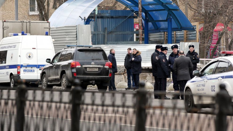 Police officers seen near a station of the Moscow Metro where a woman suspected of killing a 4-year-old child was detained, Feb. 29, 2016.