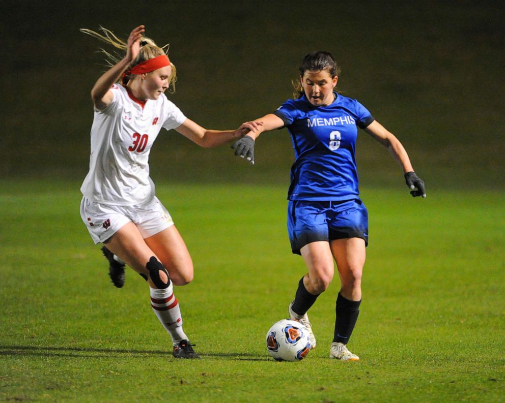 PHOTO: A Memphis midfielder and Wisconsin defender work for control of the ball, during the NCAA soccer game between the Memphis Tigers and the University of Wisconsin Badgers in Memphis, Tenn.