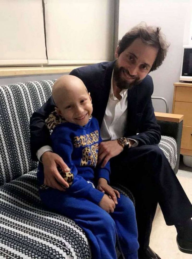 PHOTO: Nehad Dabbas sits with Abd el Karim, a child cancer patient, in 2019. 