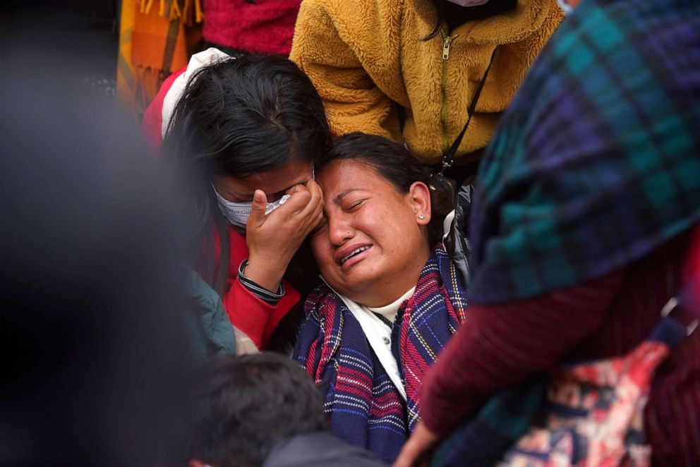 PHOTO: A woman wails as she waits to receive the body of a relative, a victim of a plane crash, at a hospital in Pokhara, Nepal, Jan 16, 2023.