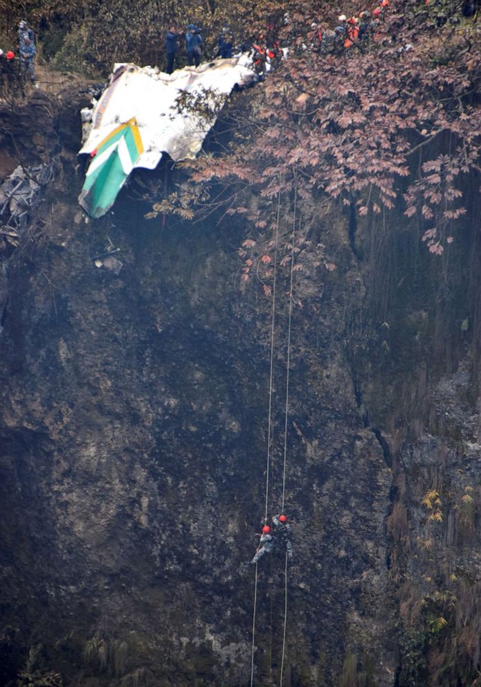 PHOTO: A rescue team works to recover the body of a victim from the site of the plane crash of a Yeti Airlines operated aircraft, in Pokhara, Nepal Jan. 16, 2023.