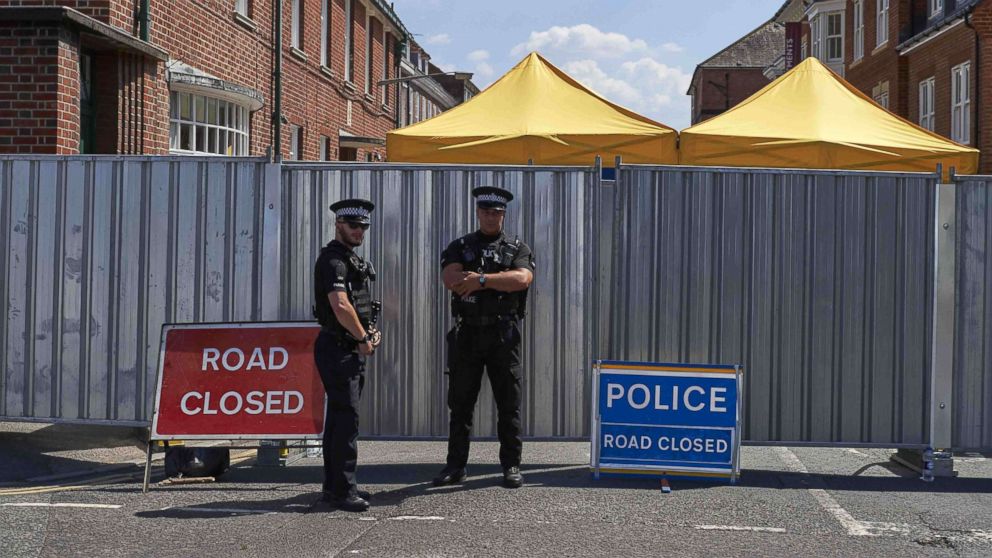 PHOTO: Police officers stand guard near barriers across Rollestone Street, outside the John Baker House Sanctuary Supported Living in Salisbury, southern England, July 8, 2018.