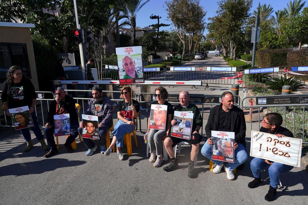 PHOTO: People protest holding posters as supporters and family members of hostages camp outside the residence of Israeli Prime Minister Benjamin Netanyahu, in Caesarea, Israel, Jan. 20, 2024. 