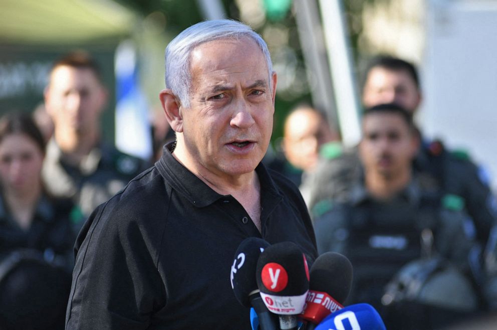 PHOTO: Israeli Prime Minister Benjamin Netanyahu speaks during a meeting with Israeli border police in the central city of Lod, near Tel Aviv, on May 13, 2021, a day after Israeli far-right groups clashed with security forces and Arab Israelis.
