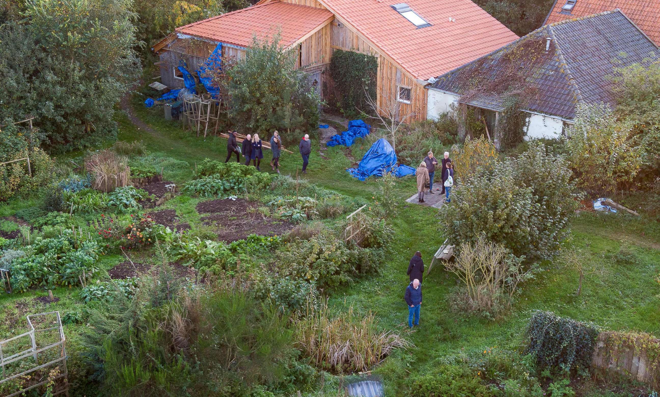 PHOTO: This drone image shows Dutch judges visiting the farmhouse in Ruinerwold, the Netherlands, where a family was allegedly held captive for nearly a decade, Oct. 30, 2019. 