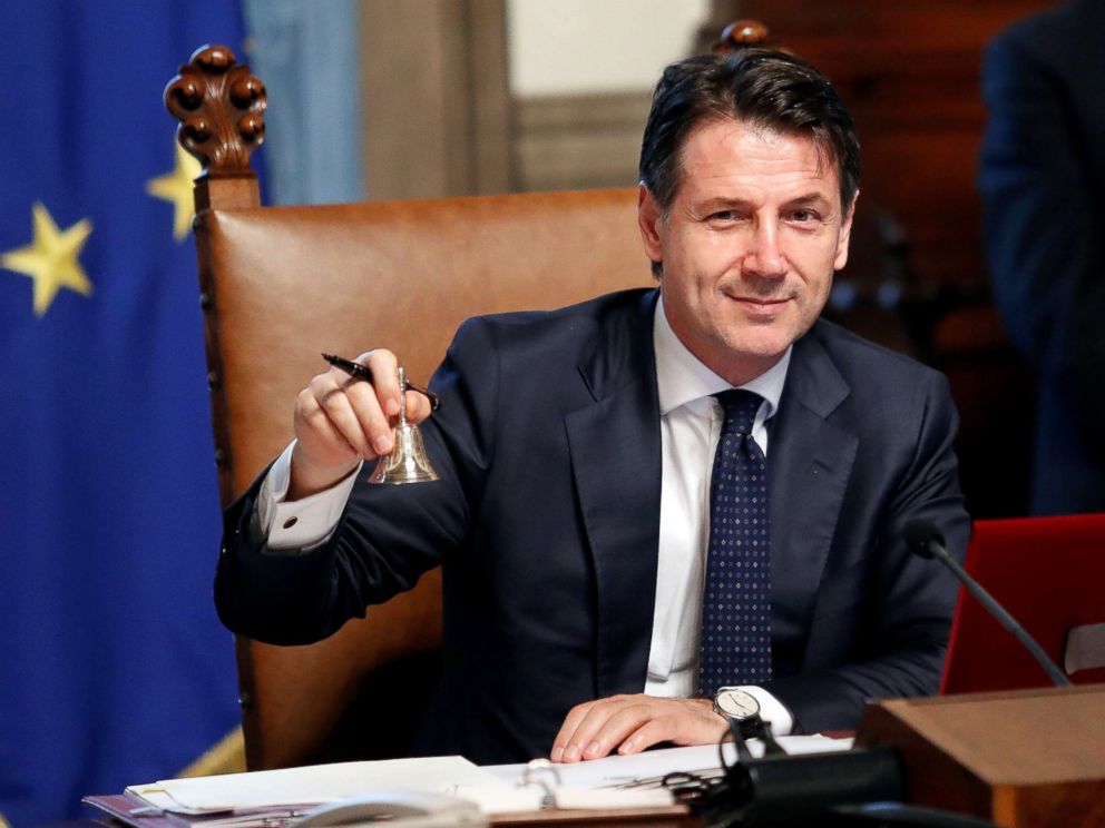 PHOTO: Newly appointed Italian Prime Minister Giuseppe Conte rings the bell during his first cabinet meeting at Chigi palace in Rome, June 1, 2018.