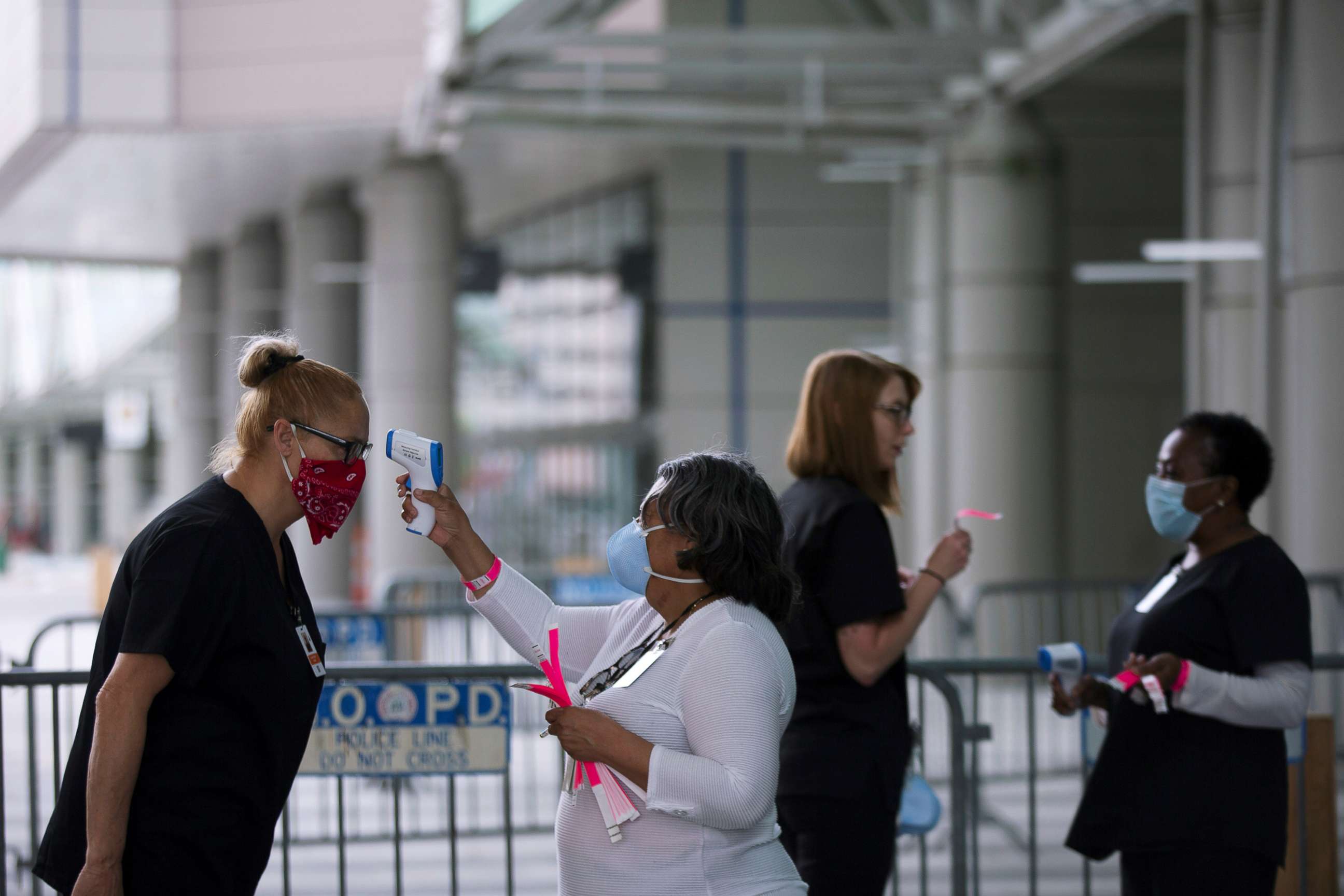 PHOTO: Medical personnel take temperature as they prepare the Ernest N. Morial Convention Center for coronavirus disease (COVID-19) patients in New Orleans, Louisiana, April 6, 2020.