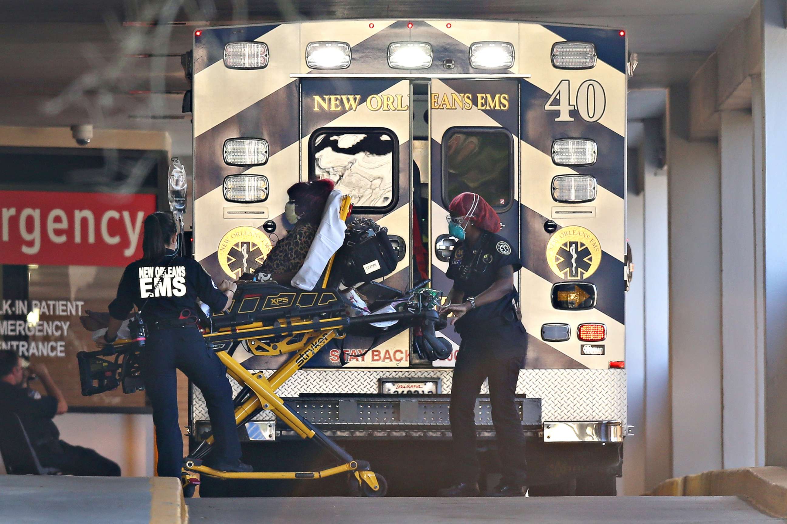 PHOTO: EMS personnel bring a patient into the emergency center at Ochsner Baptist Medical Center amid the coronavirus outbreak, in New Orleans, March 25, 2020.