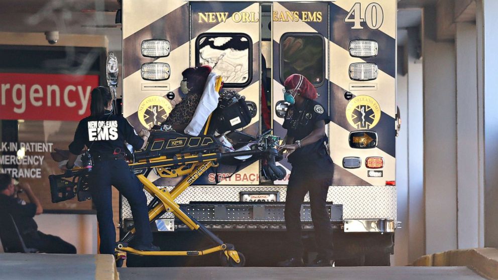 PHOTO: EMS personnel bring a patient into the emergency center at Ochsner Baptist Medical Center amid the coronavirus outbreak, in New Orleans, March 25, 2020.