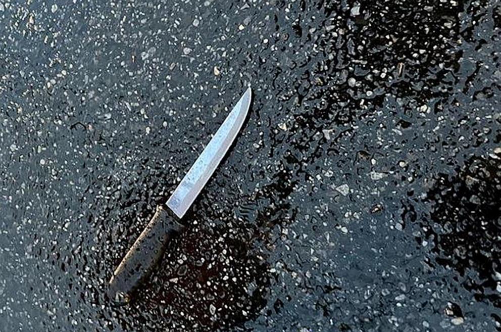 PHOTO: A knife found at the scene lies on pavement after a man, who was later shot dead by police, killed four members of his extended family and stabbed two police officers at a home in the Queens borough of New York City, Dec. 3, 2023. 