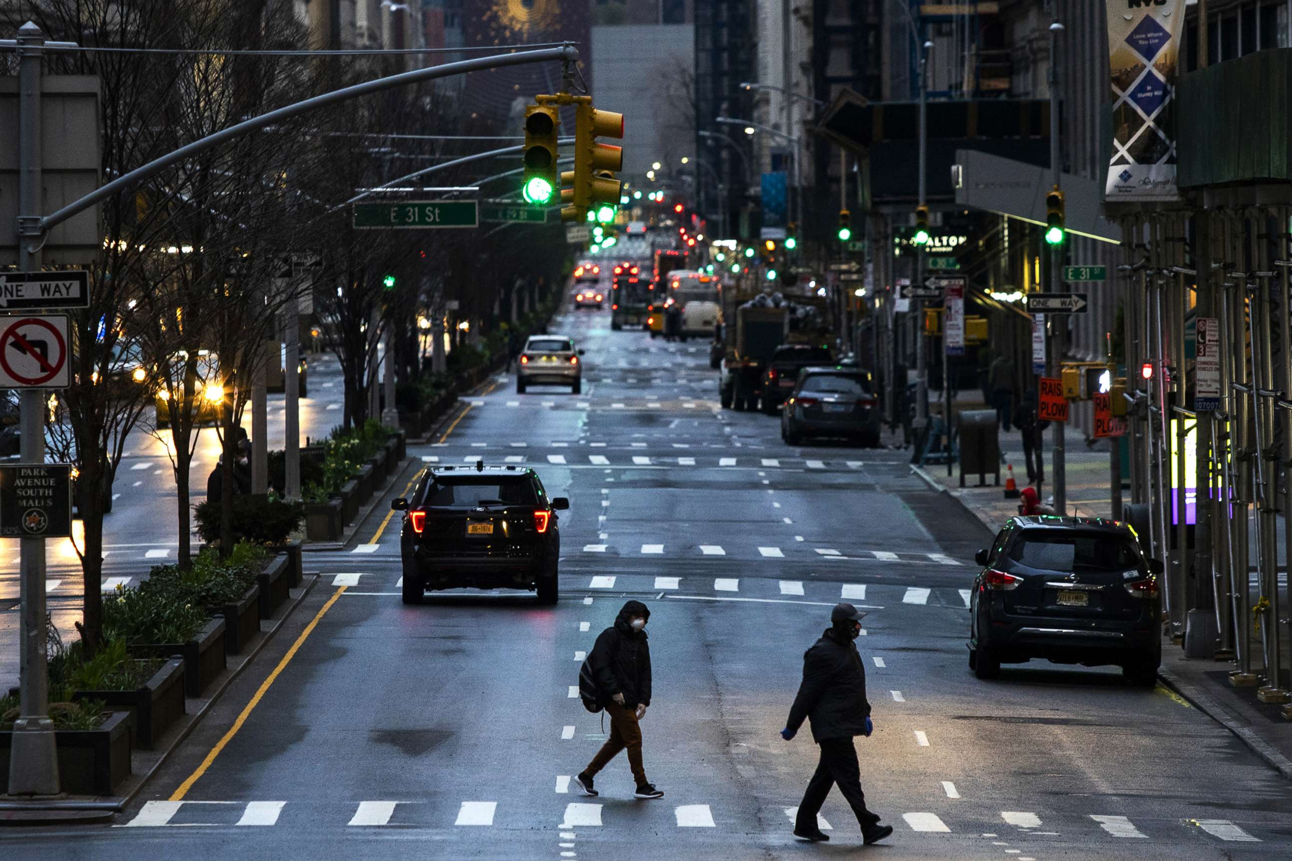 PHOTO: People cross Park Avenue after it was announced that some streets will be shut as lockdown continues in response to the coronavirus (COVID-19) outbreak, March 27, 2020, in New York City.