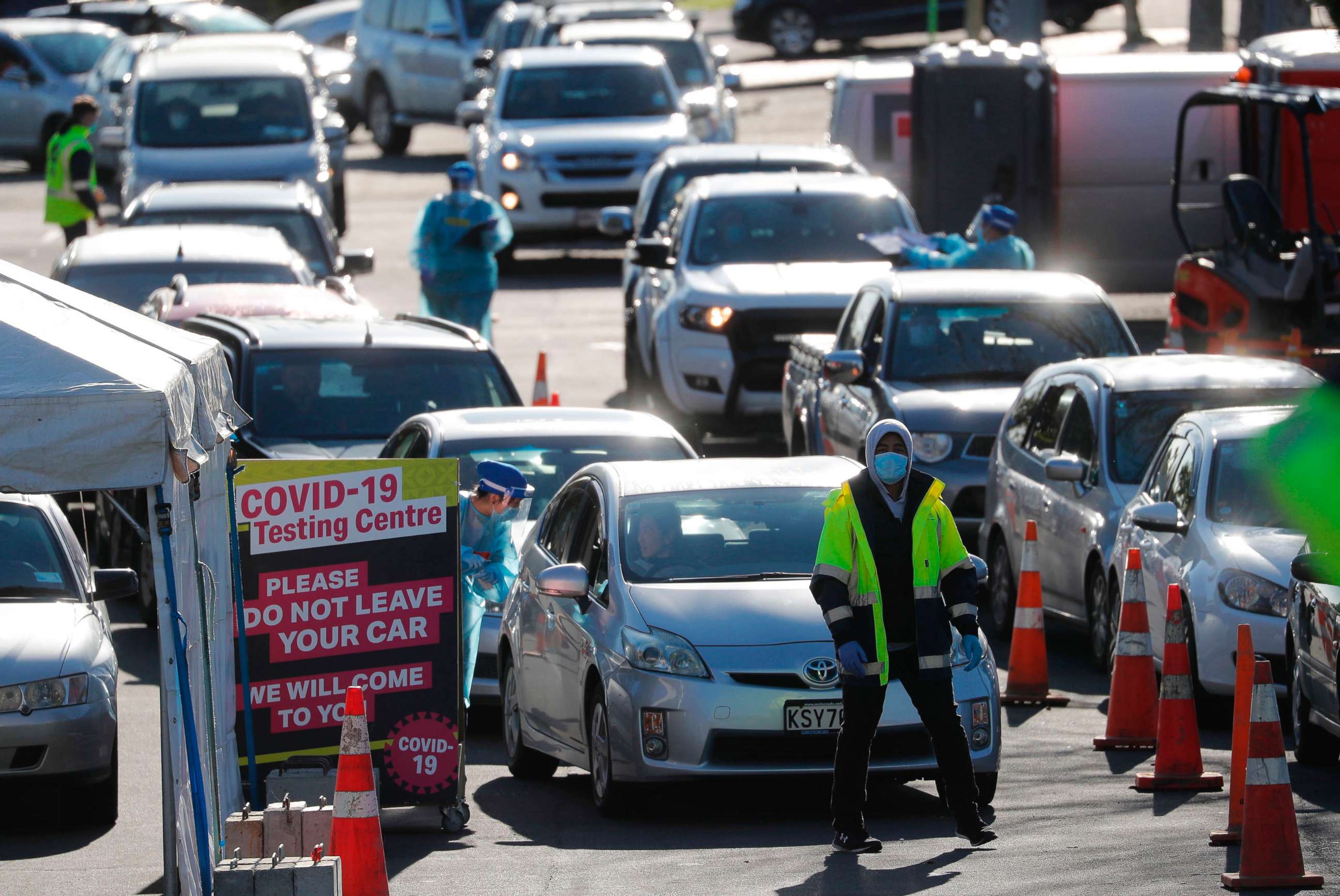 PHOTO: Cars queue at a COVID-19 test center in Auckland, Aug. 13, 2020. Health authorities in New Zealand are scrambling to trace the source of a new outbreak of the coronavirus as the nation's largest city goes back into lockdown.