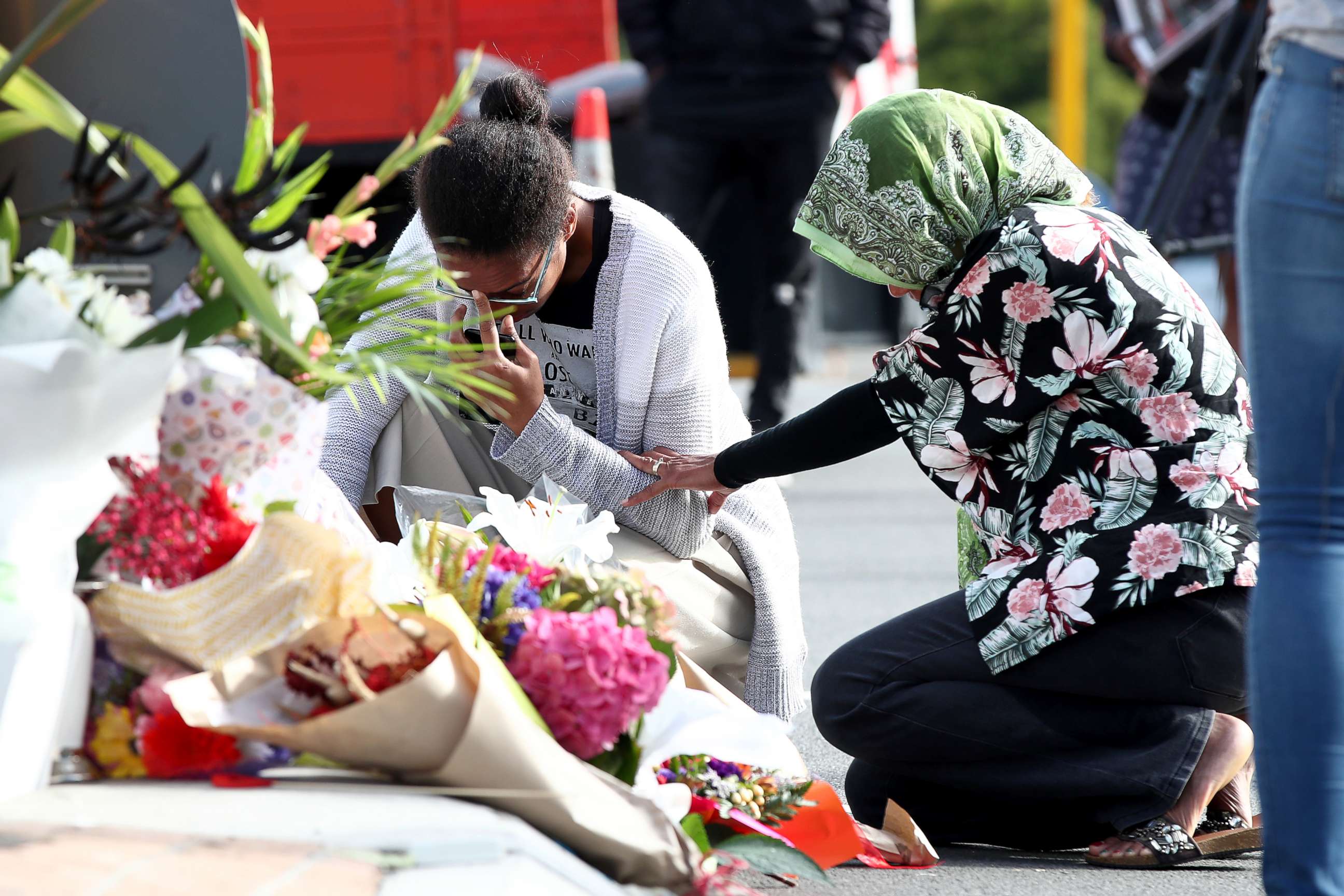 PHOTO: Locals lay flowers in tribute to those killed and injured at Deans Avenue near the Al Noor Mosque, March 16, 2019, in Christchurch, New Zealand. 