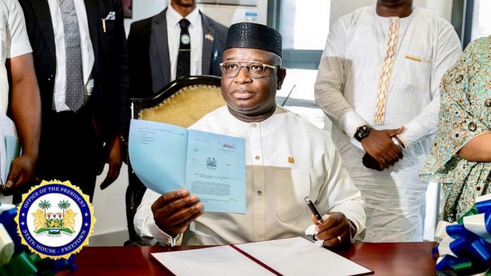 PHOTO: Sierra Leone’s President Julius Maada Bio signs into law the Gender Equality and Women’s Empowerment Act during a ceremony in Freetown on Jan. 19, 2023.