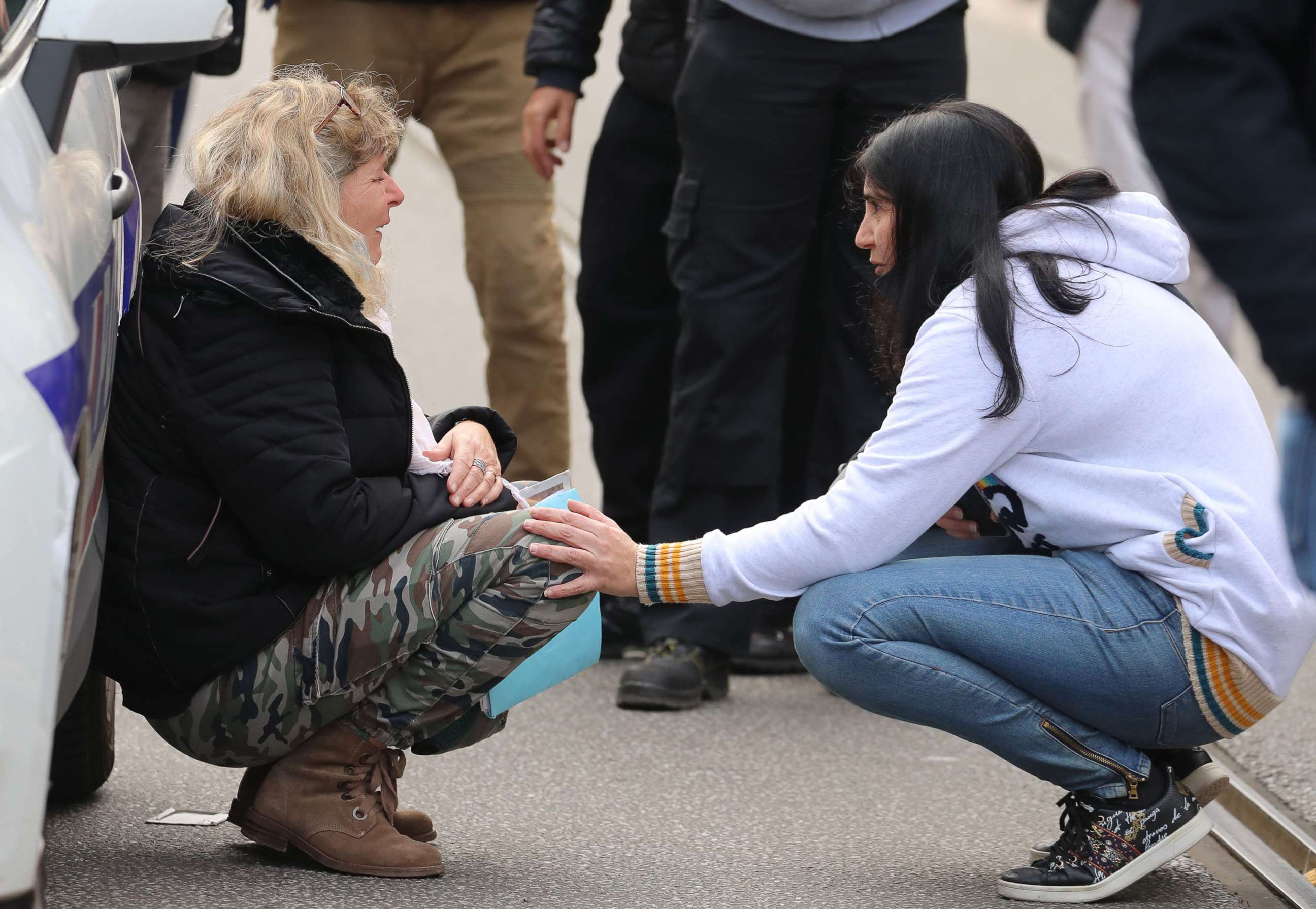 PHOTO: A woman kneels by a police car as she cries in the streets after a knife attack in Nice on Oct. 29, 2020.