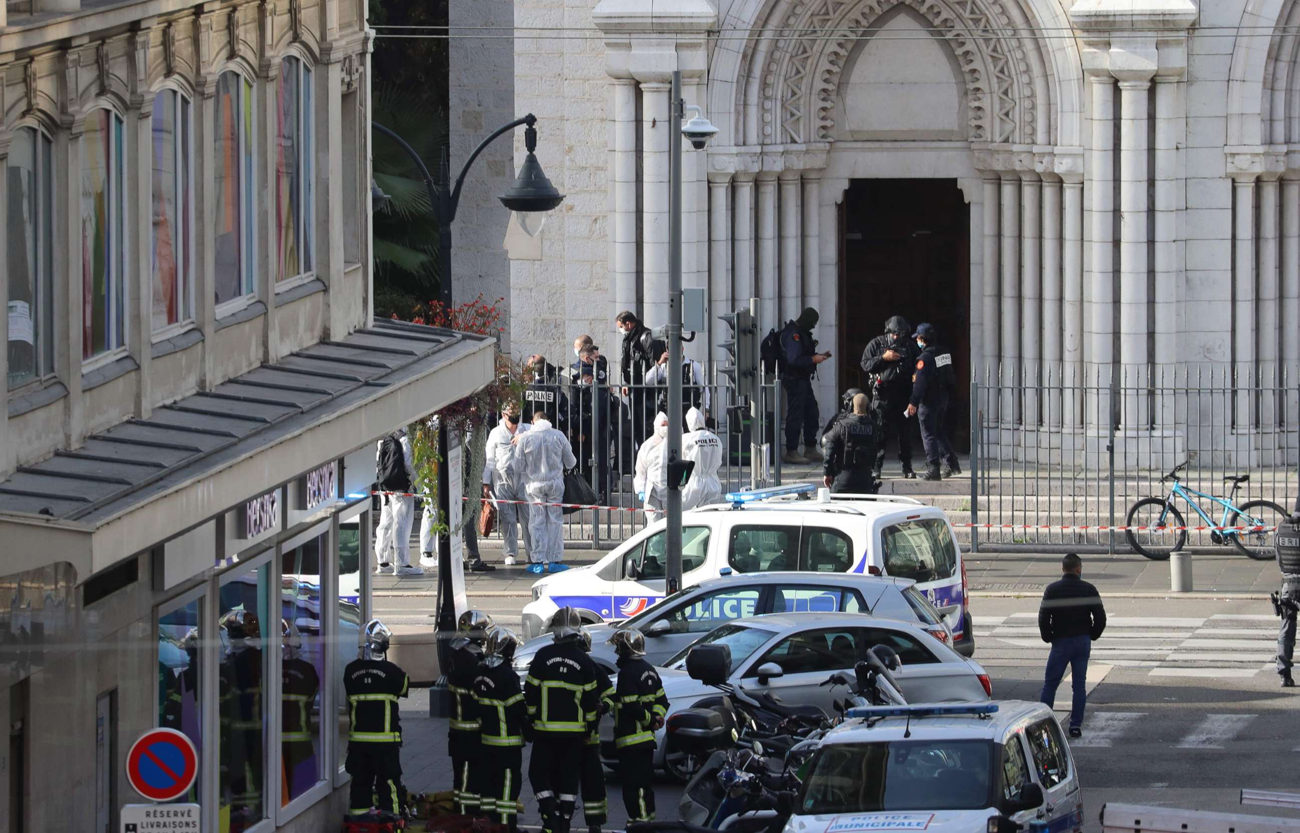 PHOTO: French members of the elite tactical police unit RAID enter to search the Basilica of Notre-Dame de Nice as forensics officers wait outside after a knife attack in Nice on Oct. 29, 2020.