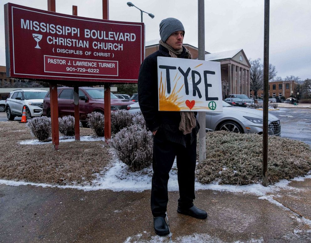 PHOTO: A man holds a sign displaying Tyre Nichols' name outside of the Mississippi Boulevard Christian Church ahead of Tyre Nichols funeral in Memphis, Tenn., Feb. 1,2023.