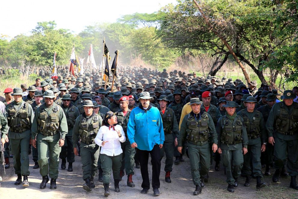 PHOTO: Handout photo released by the Venezuelan Presidency of Venezuela's President Nicolas Maduro (center) during military exercises of cadets of the Bolivarian Military University at a training center in El Pao, Cojedes state, Venezuela, May 4, 2019.