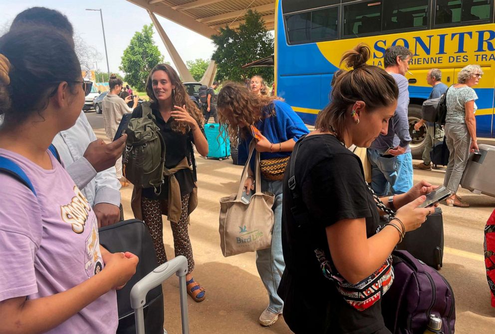 PHOTO: French nationals gather as they wait to be airlifted back to France on a French military aircraft, at the international airport in Niamey, Niger, Aug. 1, 2023.