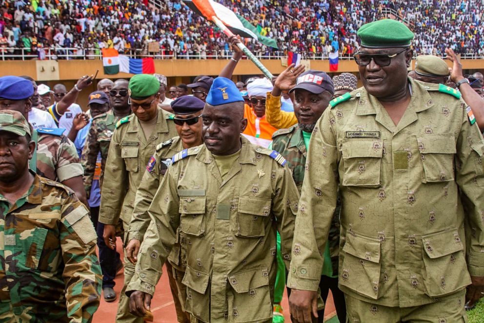 PHOTO: Members of a Nigerien military council that staged an apparent coup attend a rally at a stadium in Niamey, Niger, on Aug. 6, 2023.