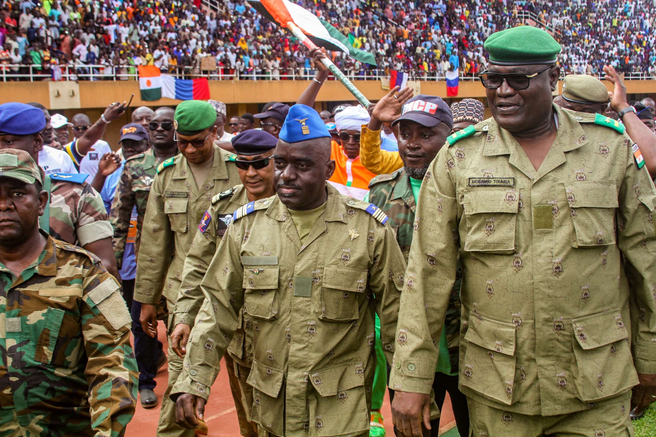 FILE PHOTO: Members of a Nigerien military council that staged an apparent coup attend a rally at a stadium in Niamey, Niger, on Aug. 6, 2023.