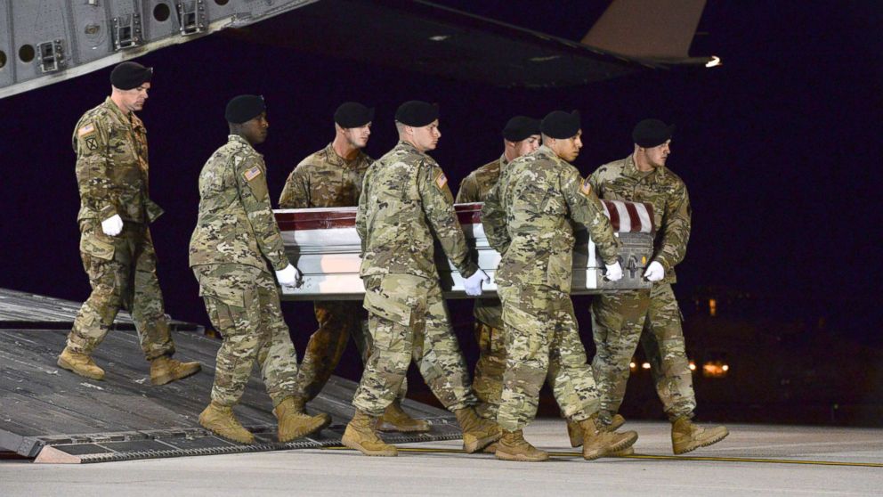 PHOTO: A U.S. Army carry team transfers the remains of Army Staff Sgt. Dustin Wright of Lyons, Ga., Oct. 5, 2017, upon arrival at Dover Air Force Base, Del. 