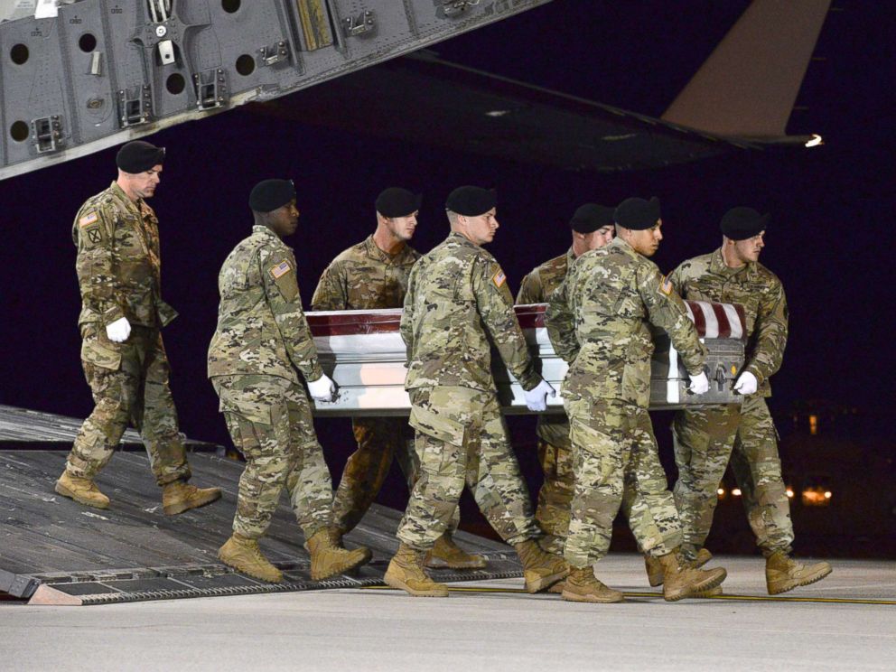 PHOTO: A U.S. Army carry team transfers the remains of Army Staff Sgt. Dustin Wright of Lyons, Ga., Oct. 5, 2017, upon arrival at Dover Air Force Base, Del.