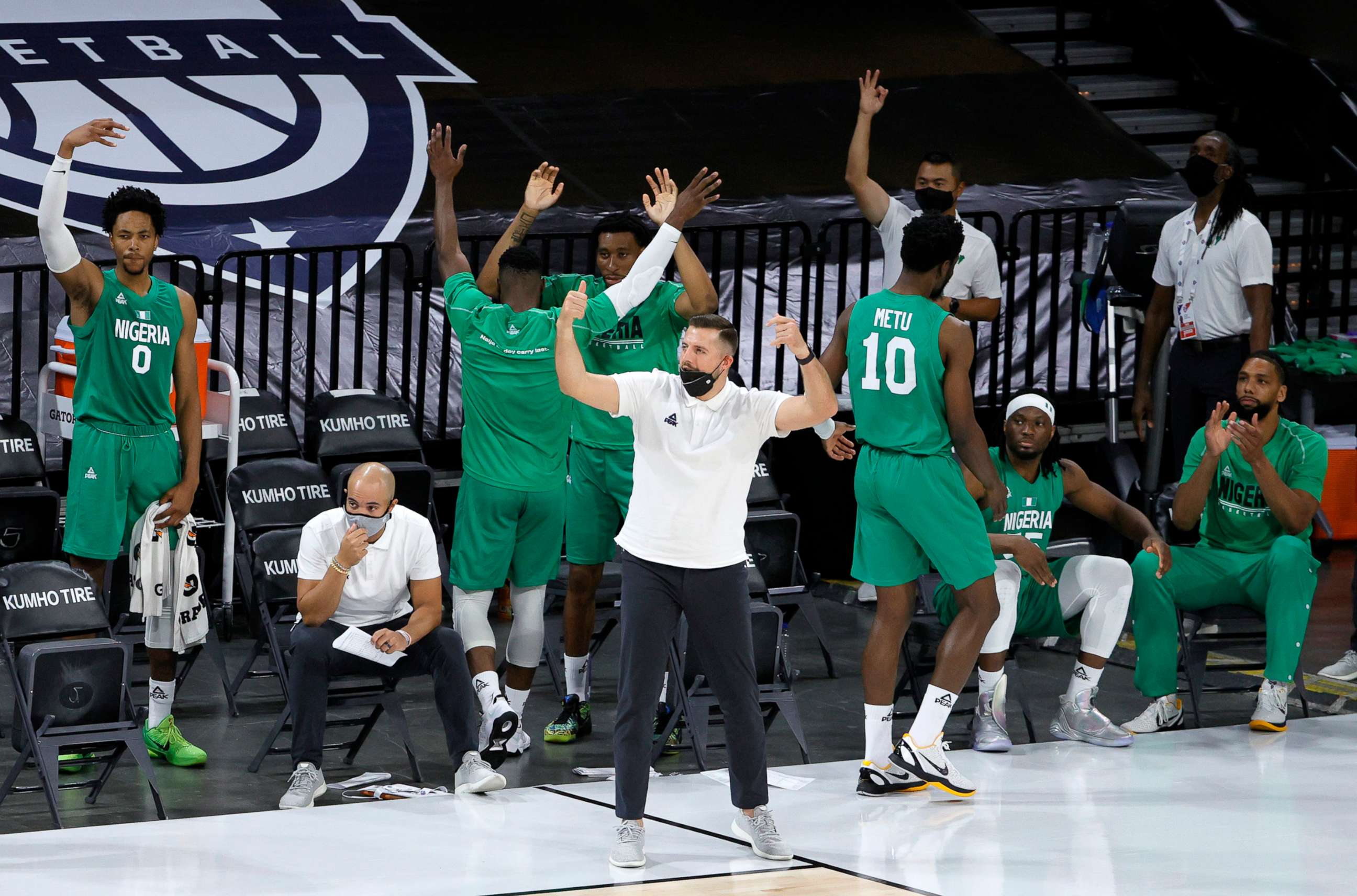 PHOTO: The Nigeria bench reacts after Ike Iroegbu #1 of Nigeria hit a 3-pointer against the United States in the fourth quarter of an exhibition game at Michelob ULTRA Arena ahead of the Tokyo Olympic Games, July 10, 2021, in Las Vegas.