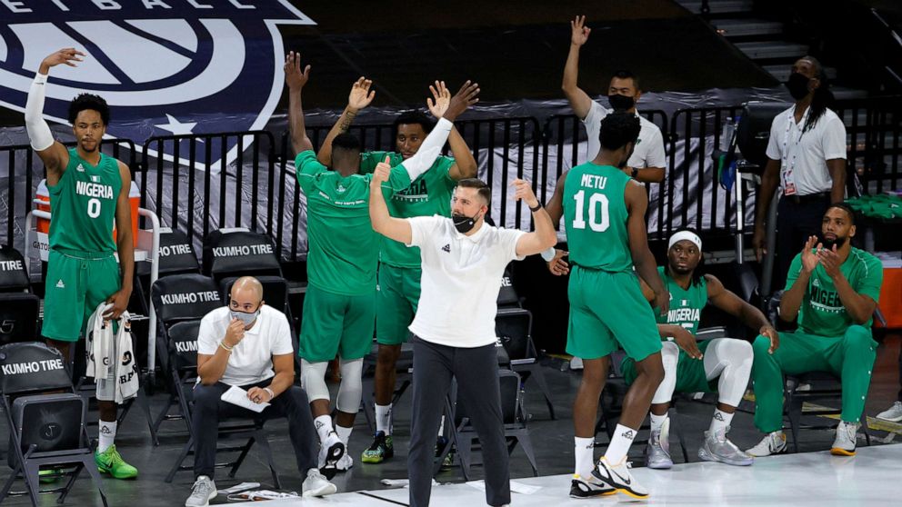 PHOTO: The Nigeria bench reacts after Ike Iroegbu #1 of Nigeria hit a 3-pointer against the United States in the fourth quarter of an exhibition game at Michelob ULTRA Arena ahead of the Tokyo Olympic Games, July 10, 2021, in Las Vegas.