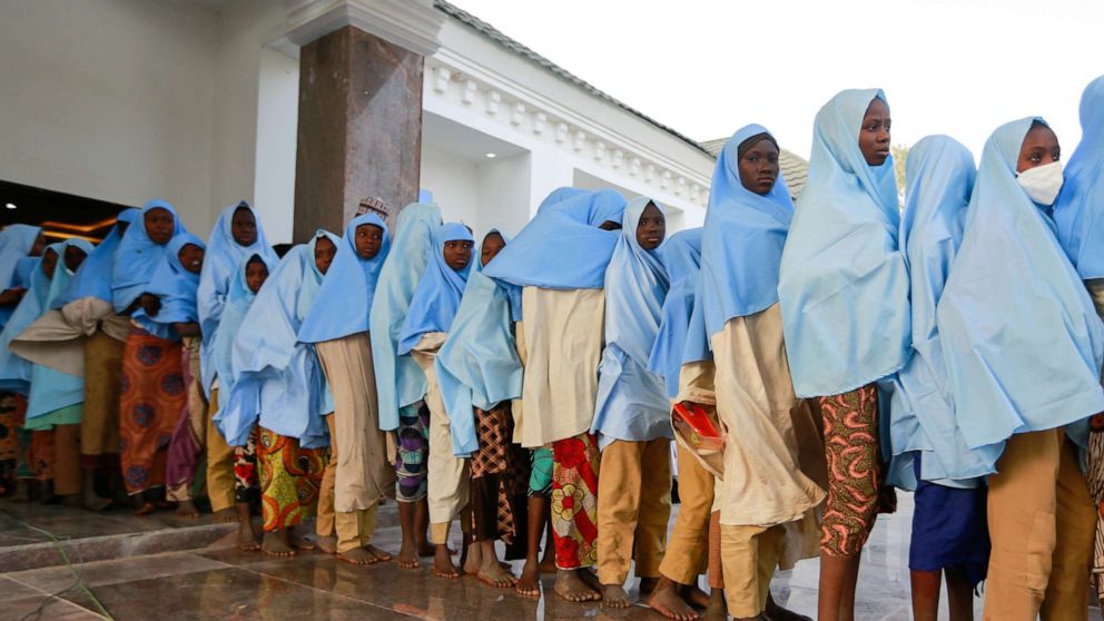 PHOTO: Girls who were kidnapped from a boarding school in the northwest Nigerian state of Zamfara, walk in line after their release in Zamfara, Nigeria, March 2, 2021.  