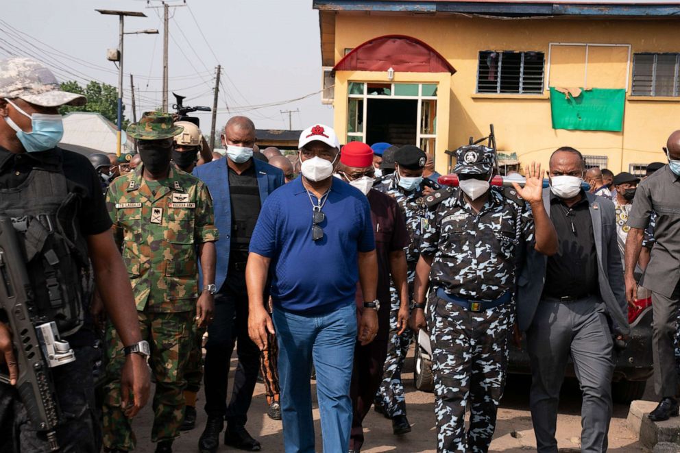 PHOTO: Imo state Gov. Hope Uzodinma, center, inspects the scene of an attack at the police command headquarters in Owerri, Nigeria, April 5, 2021, after inmates escaped from a prison in the southeastern Nigerian city after a series of coordinated attacks.