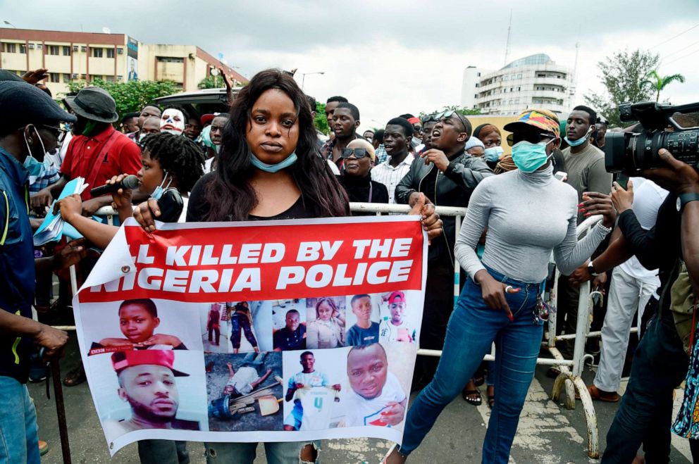 PHOTO: A woman carries a placard during ongoing demonstrations calling for the end of the controversial police unit Special Anti-Robbery Squad (SARS), Oct. 9, 2020, in Ikeja, Nigeria.